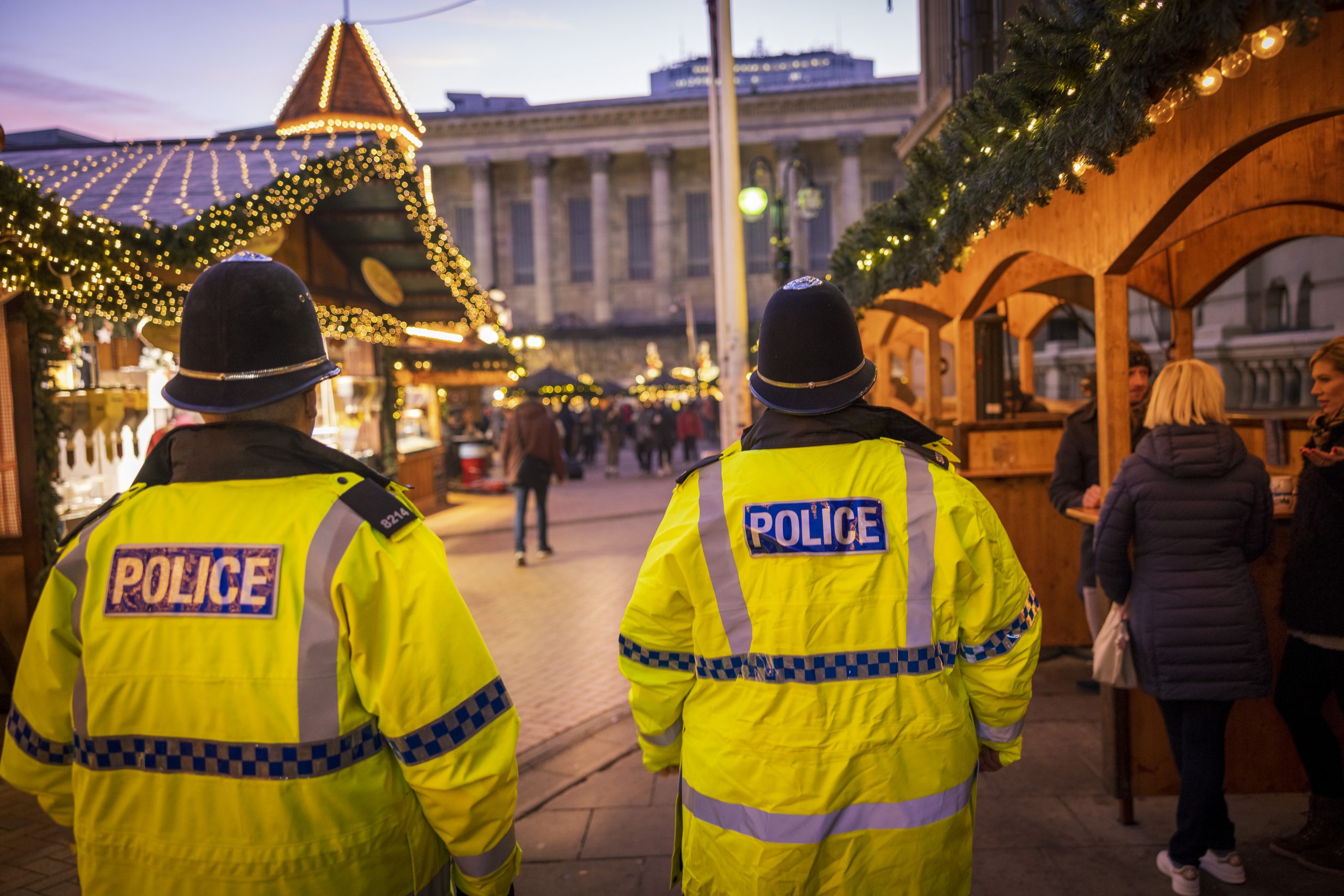 Officers walking through a xmas market