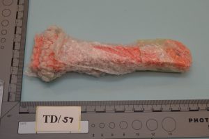 Orange glass hammer wrapped in bubble wrap